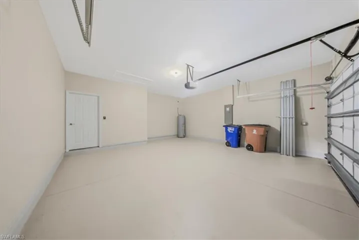 Garage with electric panel and water heater