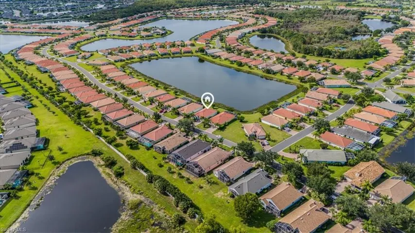 View of property location featuring a nearby body of water and nearby suburban area