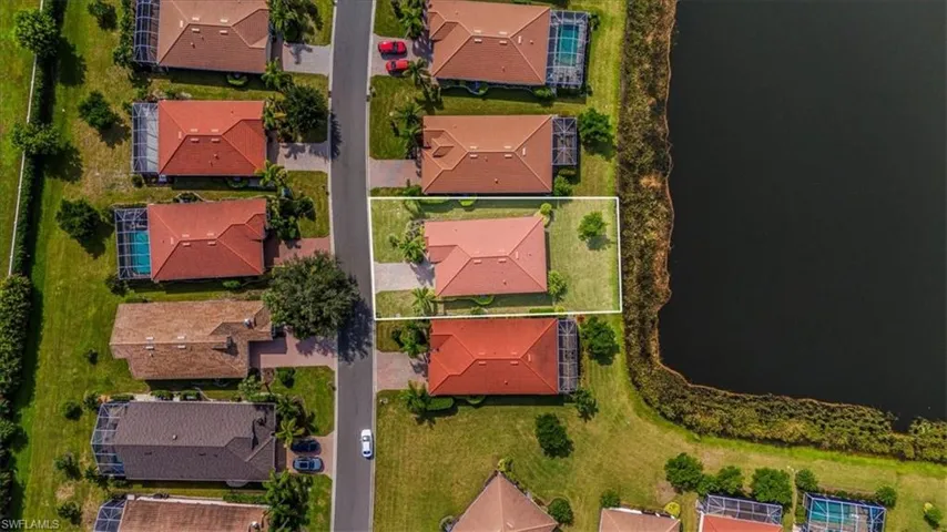 Aerial view of residential area with a nearby body of water