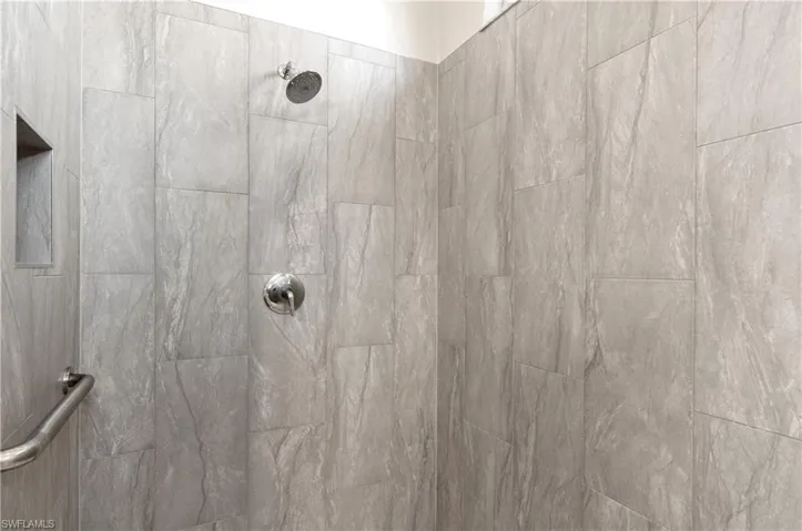 Spacious shower with lovely tile