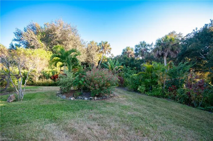 Stunning back yard with lush, mature shrubs