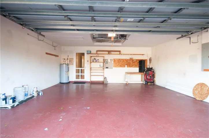 Garage with electric panel and water heater