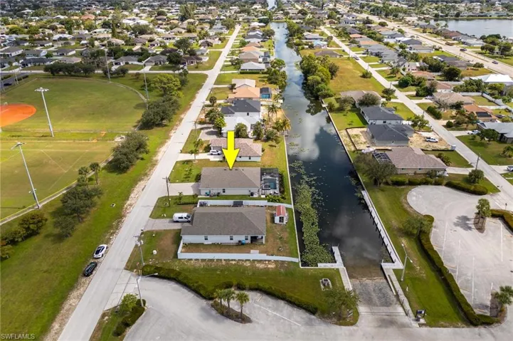 Aerial view of residential area with a large body of water