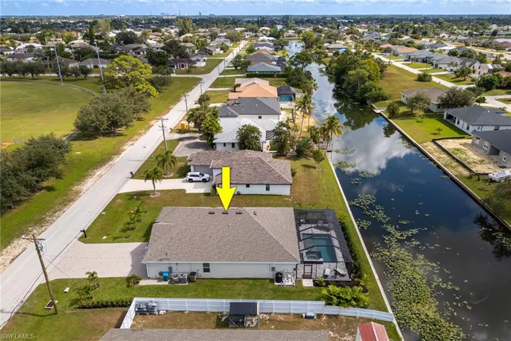 Aerial view of residential area with a nearby body of water