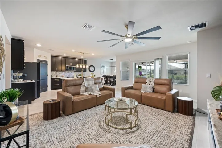 Living room featuring ceiling fan and light wood finished floors