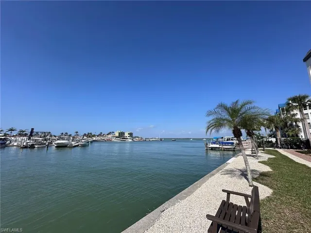 Dock area featuring a water view