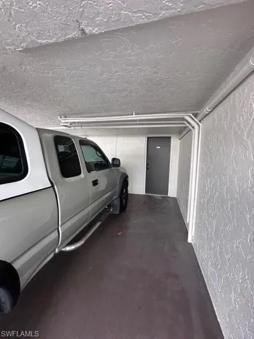 Parking garage featuring a textured wall