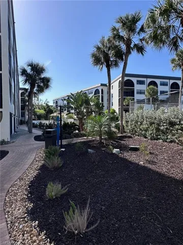 View of community featuring fence