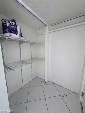 Walk in closet featuring light tile patterned floors