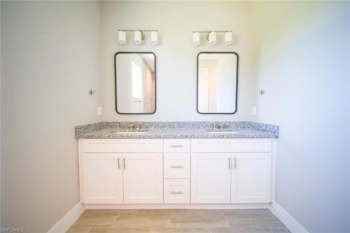 The Master Bathroom Has Dual Sinks, Granite Countertops, Dual Mirrors, And A Walk-In Tile Shower!