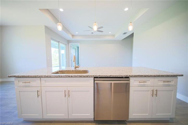 The Island Kitchen Has Granite Countertops, Tile Backsplash, Stainless Steel Appliances, White Shaker Soft Touch Cabinets And Drawers, And A Large Walk-In Pantry!