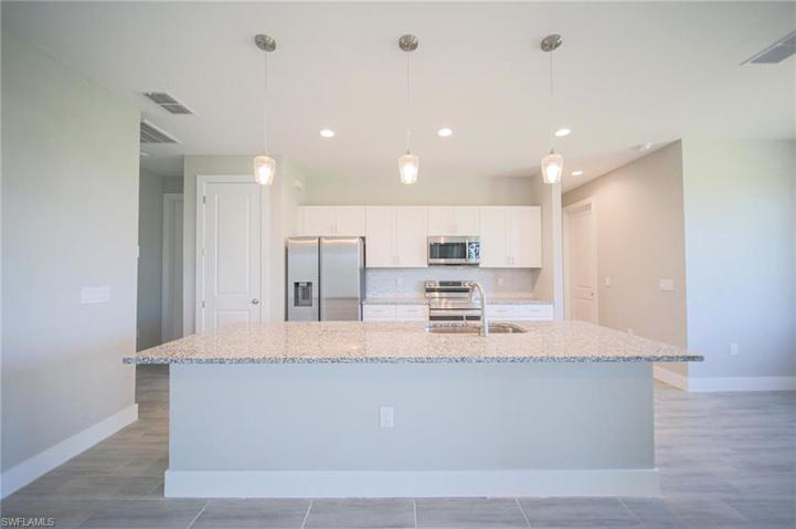 The Island Kitchen Has Granite Countertops, Tile Backsplash, Stainless Steel Appliances, White Shaker Soft Touch Cabinets And Drawers, And A Large Walk-In Pantry!