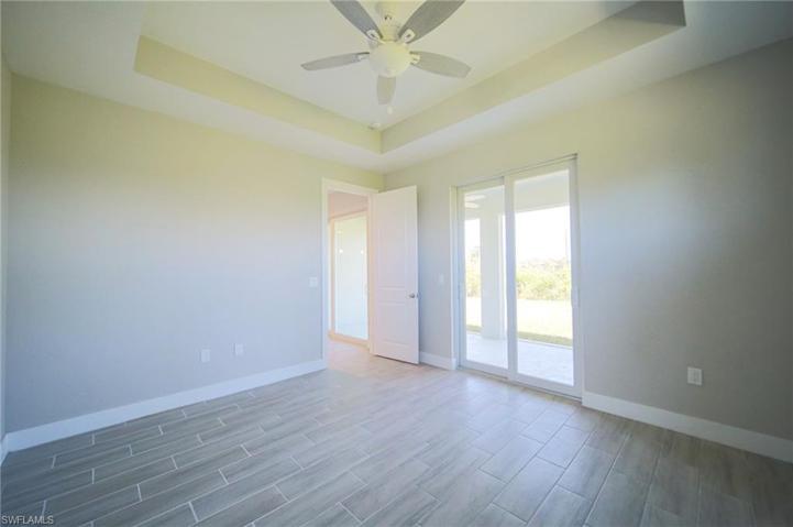 The Tiled Living Room Has Double Front Entry Doors And A Double Glass Slider Out To Covered Screened Lanai!