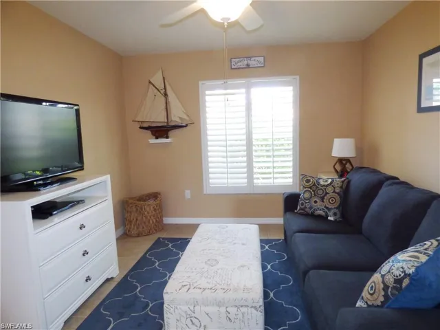 Tiled living room with ceiling fan
