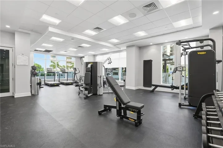Exercise room featuring a paneled ceiling - Virtually Edited Image