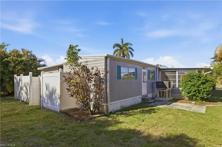 Back of house featuring a sunroom