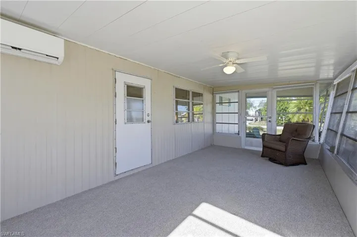 Sunroom featuring ceiling fan and a mini split for heating / cooling