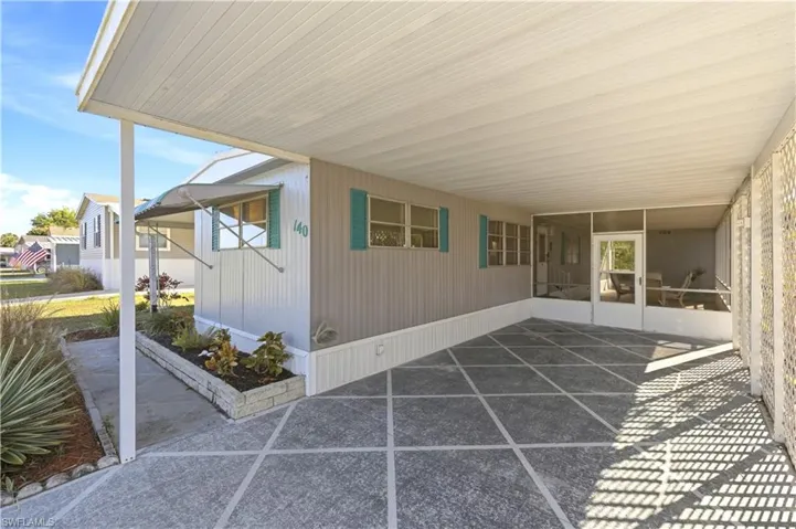 View of patio featuring a carport