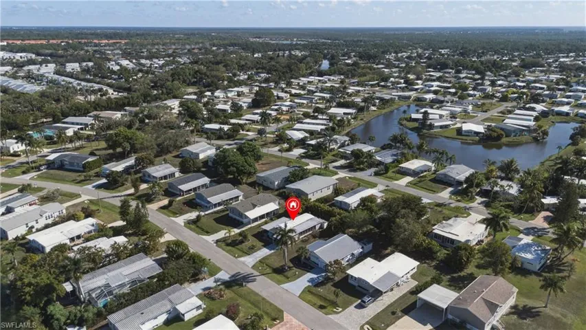 View of property location featuring nearby suburban area and a nearby body of water