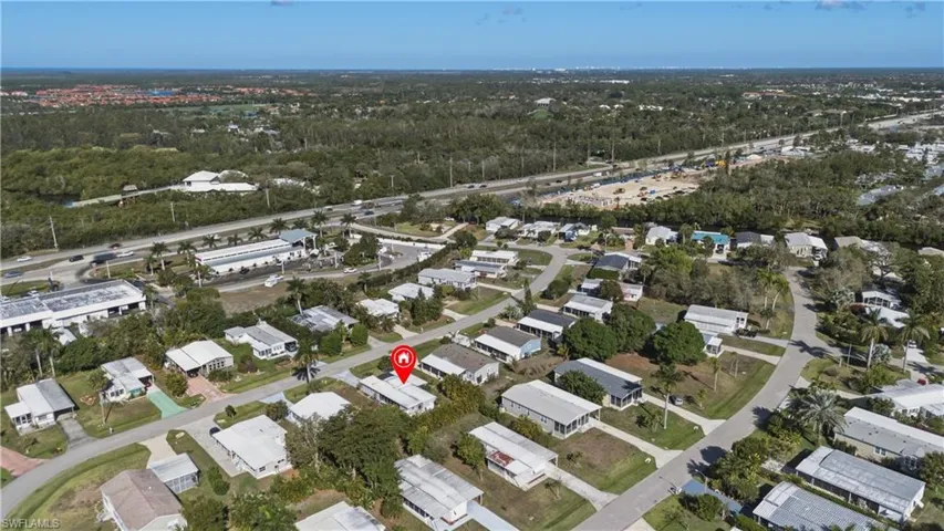 Aerial overview of property's location with nearby suburban area