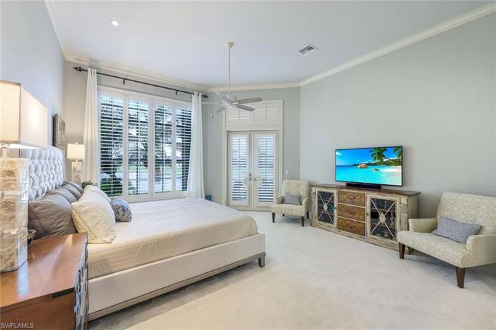The primary bedroom also overlooks the lake.
