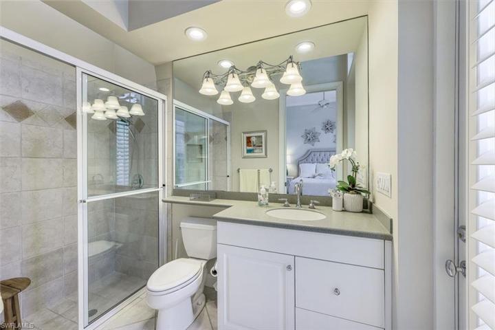 En suite guest bathroom, also with courtyard access.