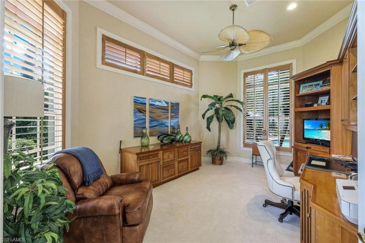Den/office, located just off the foyer and formal living room. Built in cabinets are just a few of this room's unique features.