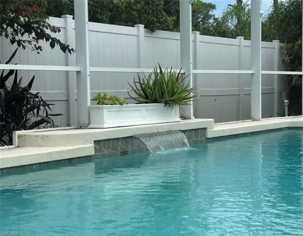 Enclosed swimming pool with spa