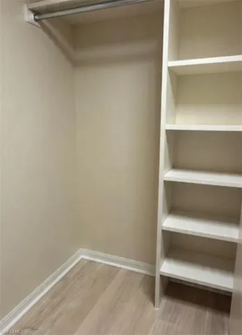 Walk in closet with built in shelving