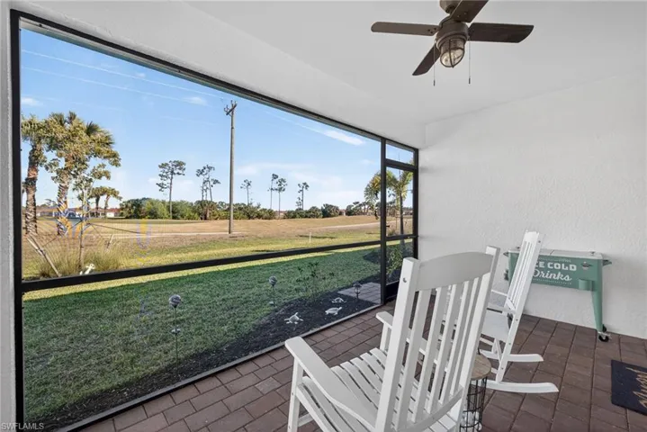 Lanai featuring a ceiling fan and golf course views