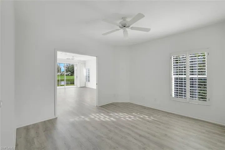 3rd bedroom or den looking out to great room and view of lake
