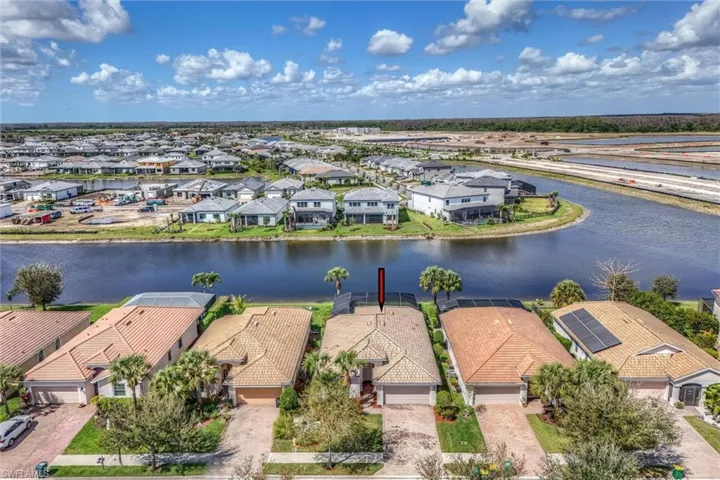 Aerial perspective of suburban area with a large body of water