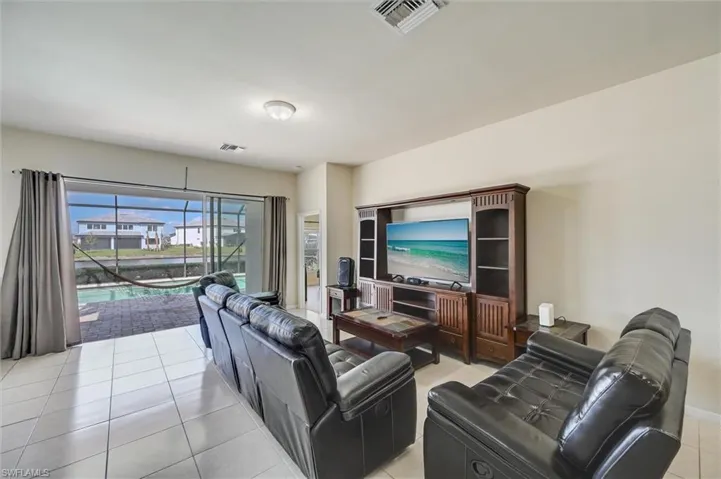 Living area featuring light tile patterned flooring
