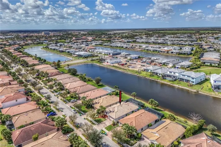 Aerial perspective of suburban area with a large body of water