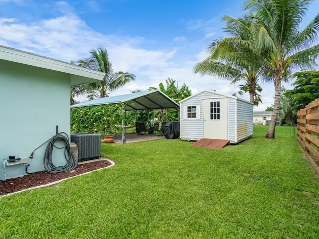 View of the shed and fruit trees.