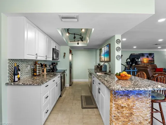 Kitchen with granite countertops.