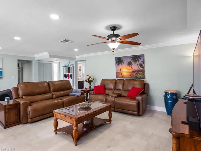 Living room with ceiling fan.