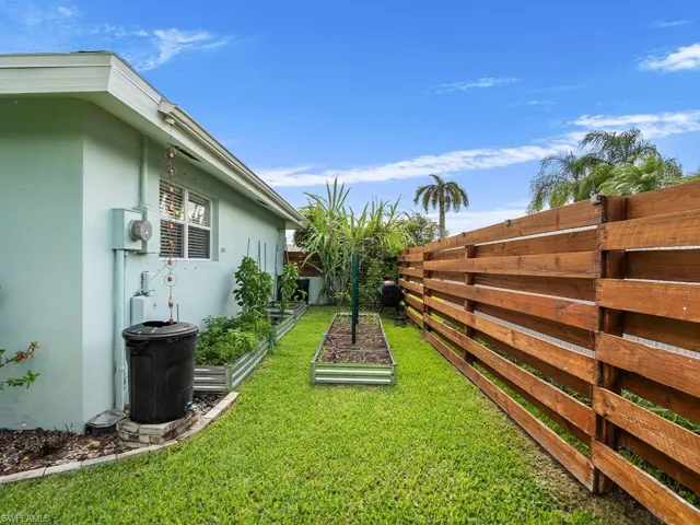 Side of the patio showing gardening space.
