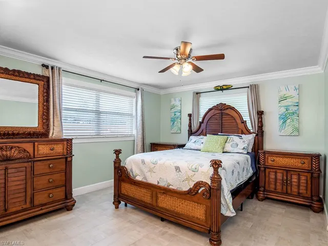 Master bedroom with wooden furniture.
