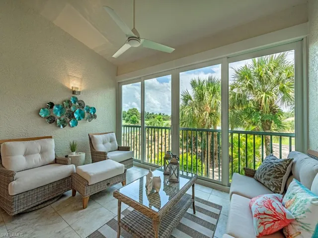 Sunroom featuring ceiling fan