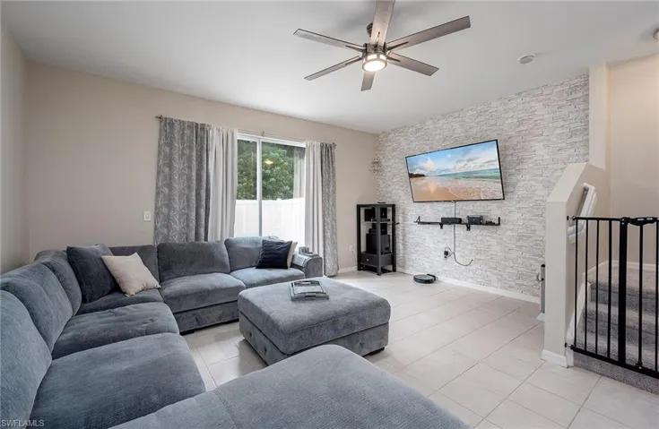Tiled living room with ceiling fan