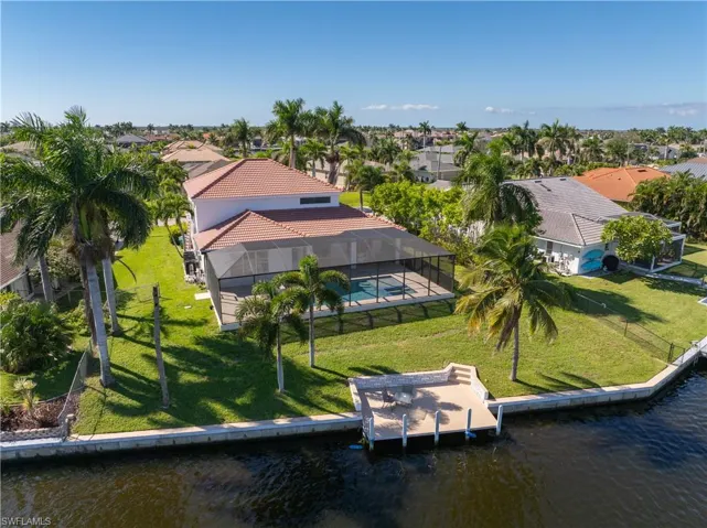 Aerial perspective of suburban area with a nearby body of water