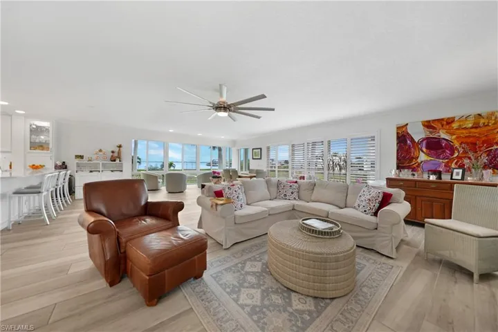 Living room featuring ceiling fan and light wood-type flooring