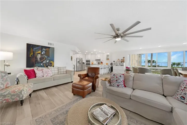 Living room featuring light hardwood / wood-style floors and ceiling fan