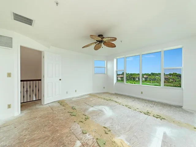 Empty room featuring ceiling fan