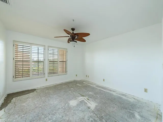 Unfurnished room featuring ceiling fan