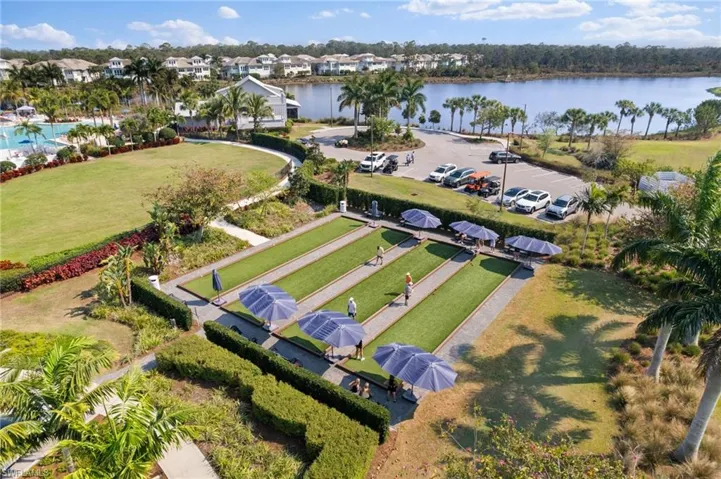 Aerial view of residential area featuring a nearby body of water