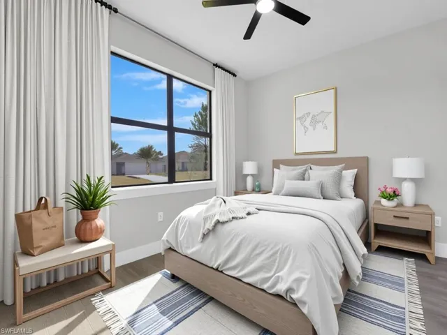 Bedroom featuring wood finished floors and ceiling fan