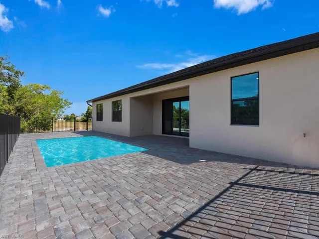 View of swimming pool with patio surround