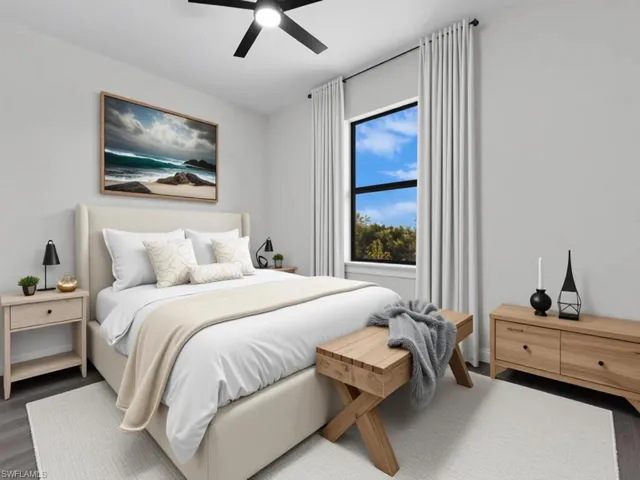 Bedroom featuring wood finished floors and a ceiling fan